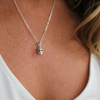 White Stone Eyes Skull Head Charm