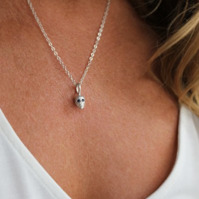 White Stone Eyes Skull Head Charm