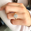 4 Ct Oval Moissanite & .30 Ctw Lab Diamond Tapered Baguette Engagement Ring