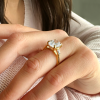 4 Ct Oval Moissanite & .30 Ctw Lab Diamond Tapered Baguette Engagement Ring